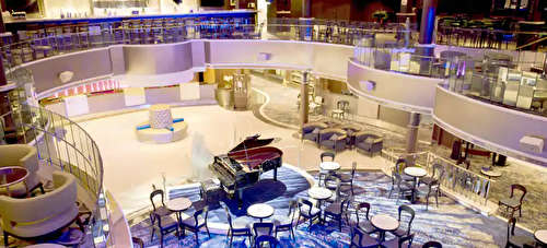 Live it up at the Grand Atrium, the heart of Norwegian Dawn